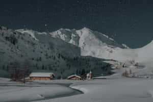 Winter Night Desktop With Cabins Wallpaper