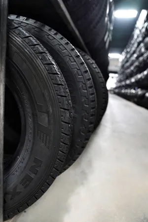 Winter Tires In Action On Snowy Road Wallpaper