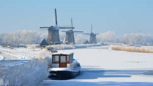 Winterin Leeuwarden Windmillsand Frozen Canal Wallpaper