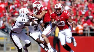 Wisconsin Badgers Football Team In Action Wallpaper