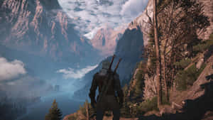 Witcher_ Gazing_at_ Mountainous_ Landscape Wallpaper