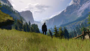 Witcher Gazing Over Kaer Morhen Valley Wallpaper