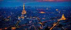 Witness The Beauty Of The Paris Skyline At Night Wallpaper