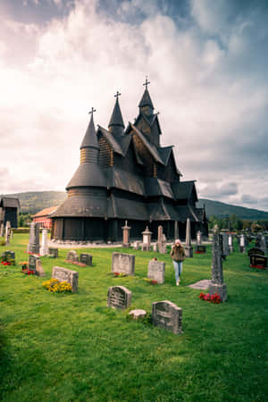 Woman At Heddal Stave Church Wallpaper