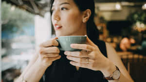 Woman Enjoying Morning Coffee Wallpaper