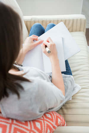 Woman Flipping Through Pages Casually Wallpaper