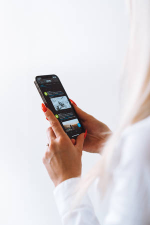 Woman Holding A High Resolution Iphone Wallpaper