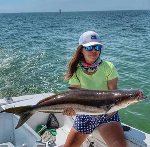 Woman Holding Cobiaon Boat Wallpaper