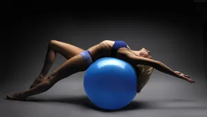 Woman In Pilates With Ball Wallpaper