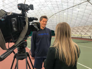 Woman Interviewing Thomas Enqvist Wallpaper