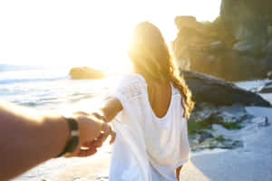 Woman Lead Person To Beach Wallpaper