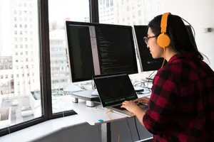 Woman Learning About Coding Wallpaper