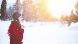 Woman Praying On The Snow Wallpaper