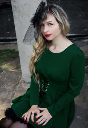 Woman Showcasing Retro-style Hairdo With Sustainable Fascination Wallpaper