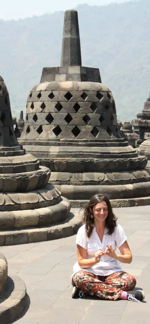 Woman Sitting On The Floor Of Borobudur Temple Wallpaper