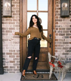 Woman Standingby Front Door Wallpaper