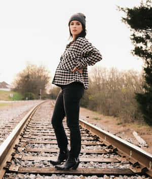 Woman Standingon Railroad Tracks Wallpaper