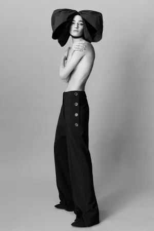 Woman Wearing Oversized Patou Bow Wallpaper