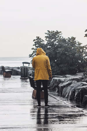 Woman Wearing Yellow Raincoat In The Rain Wallpaper