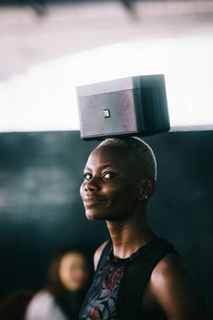 Woman With Stereo On Head In Sierra Leone Wallpaper