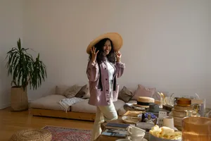 Woman With Straw Hat And Purple Jacket Wallpaper