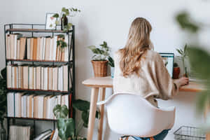 Woman Working At Home On A Laptop Wallpaper