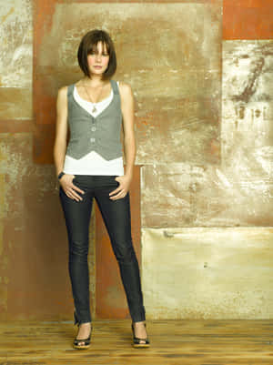 Womanin Casual Attire Against Textured Backdrop.jpg Wallpaper