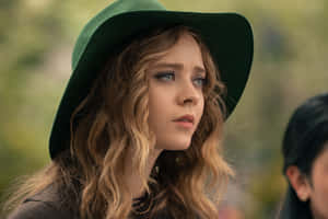 Womanin Green Hat Pensive Look Wallpaper