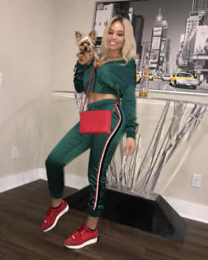 Womanwith Dogin Stylish Outfit Wallpaper