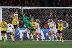 Women Soccer Goalkeeper Save Action Wallpaper