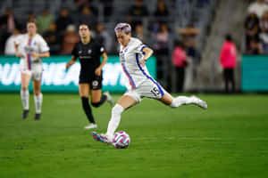 Women Soccer Player In Action.jpg Wallpaper