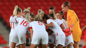 Women Soccer Team Huddle_ Match Day Wallpaper