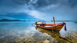 Wooden Boat On Clear Water Wallpaper