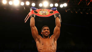 World Champion Anthony Joshua Flaunting His Red Belt Wallpaper