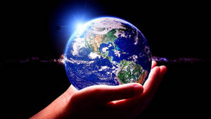 World Globe In Hands Wallpaper