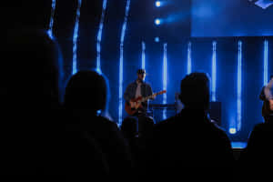 Worship_ Leader_ Guitar_ Performance Wallpaper