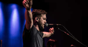 Worship_ Leader_ Performing_on_ Stage.jpg Wallpaper