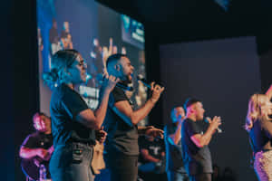 Worship_ Leaders_ Performing_ On_ Stage.jpg Wallpaper