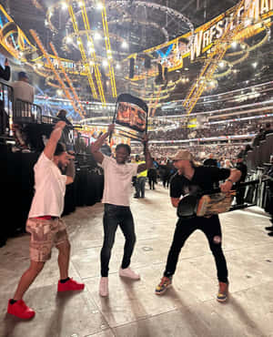 Wrestle Mania Fans With Championship Belts Wallpaper