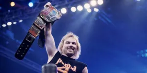 Wrestler Holding Championship Belt Wallpaper