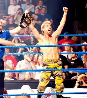 Wrestler Victory Celebrationwith Championship Belt Wallpaper