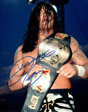 Wrestler_with_ Championship_ Belt_ Autographed_ Photo Wallpaper