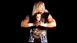 Wrestler_with_ Manikin_ Head_and_ Championship_ Belt Wallpaper