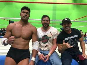 Wrestlers Posingin Ring Side Area Wallpaper