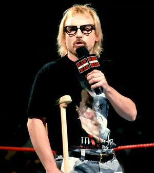 Wrestlerwith Microphoneand Crutch Wallpaper