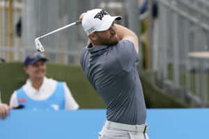 Wyndham Clark During A Golf Competition Wallpaper