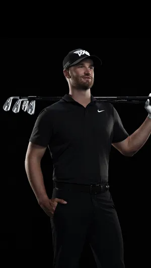 Wyndham Clark Swinging His Golf Club On A Bright Sunny Day Wallpaper