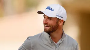 Wyndham Clark Swinging The Club At A Lush Green Golf Course Wallpaper