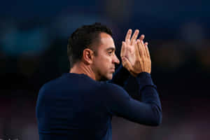 Xavi Hernandez Clappingon Sideline Wallpaper