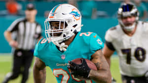 Xavien Howard Football Action Shot Wallpaper